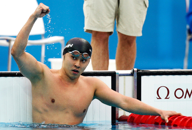 Image: Kosuke Kitajima of Japan reacts after winning the gold medal in the men's 200 meters breaststroke final
